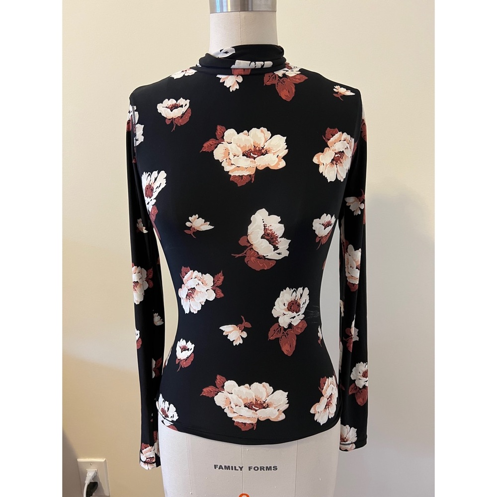 Levi’s black floral turtleneck blouse